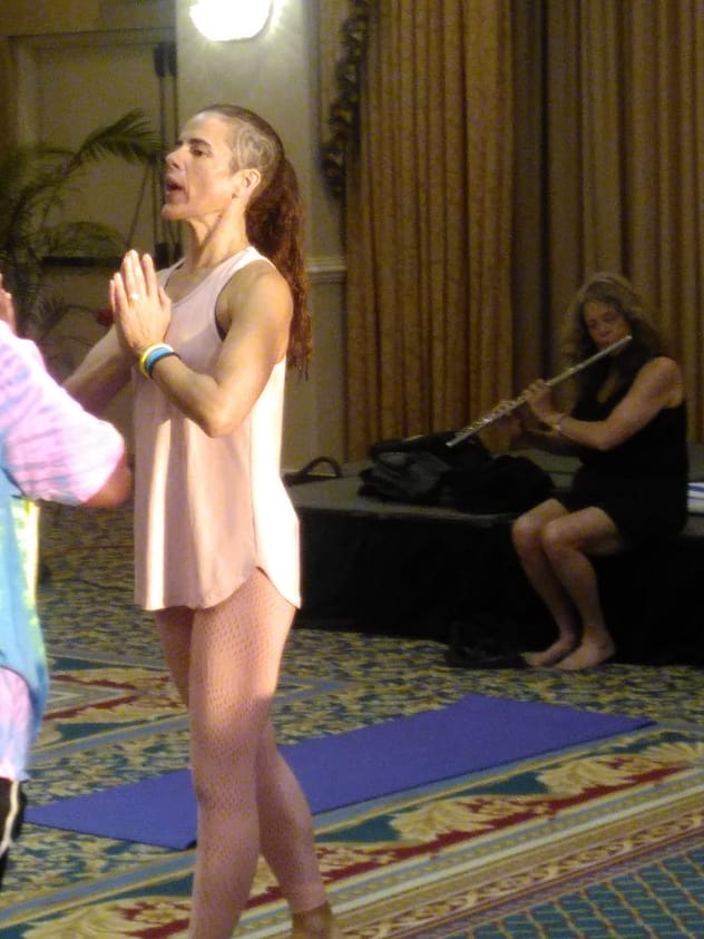 RIse & Shine Yoga with Tinoca at IAFC2019. Marla is playing the flute.